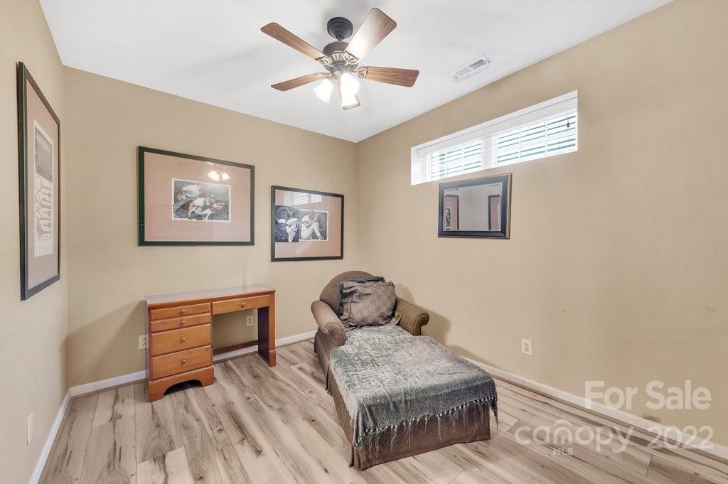 584 6th Baxter Crossing Fort Mill, SC 29708 - Photo 18 of 21 a bedroom with furniture and a window