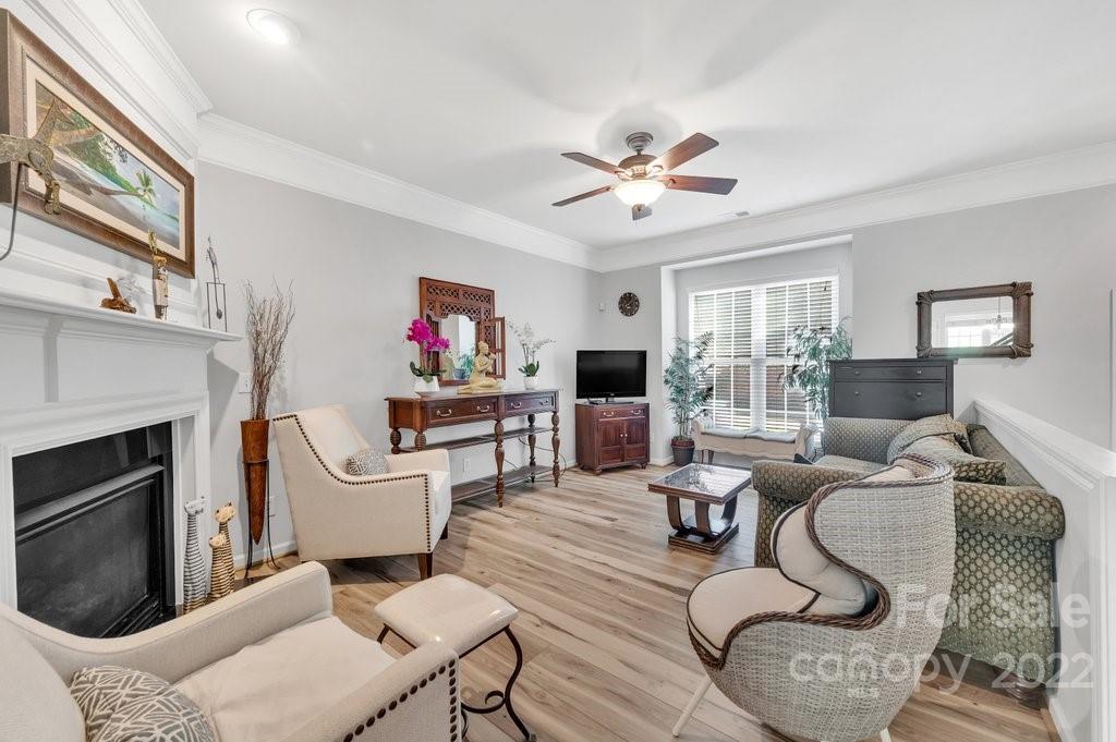 584 6th Baxter Crossing Fort Mill, SC 29708 - Photo 4 of 21 a living room with furniture a fireplace and a window