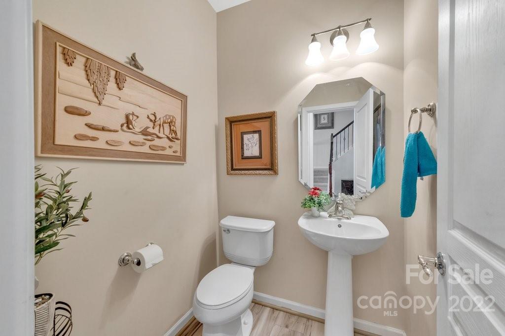 584 6th Baxter Crossing Fort Mill, SC 29708 - Photo 6 of 21 a bathroom with a toilet sink and mirror