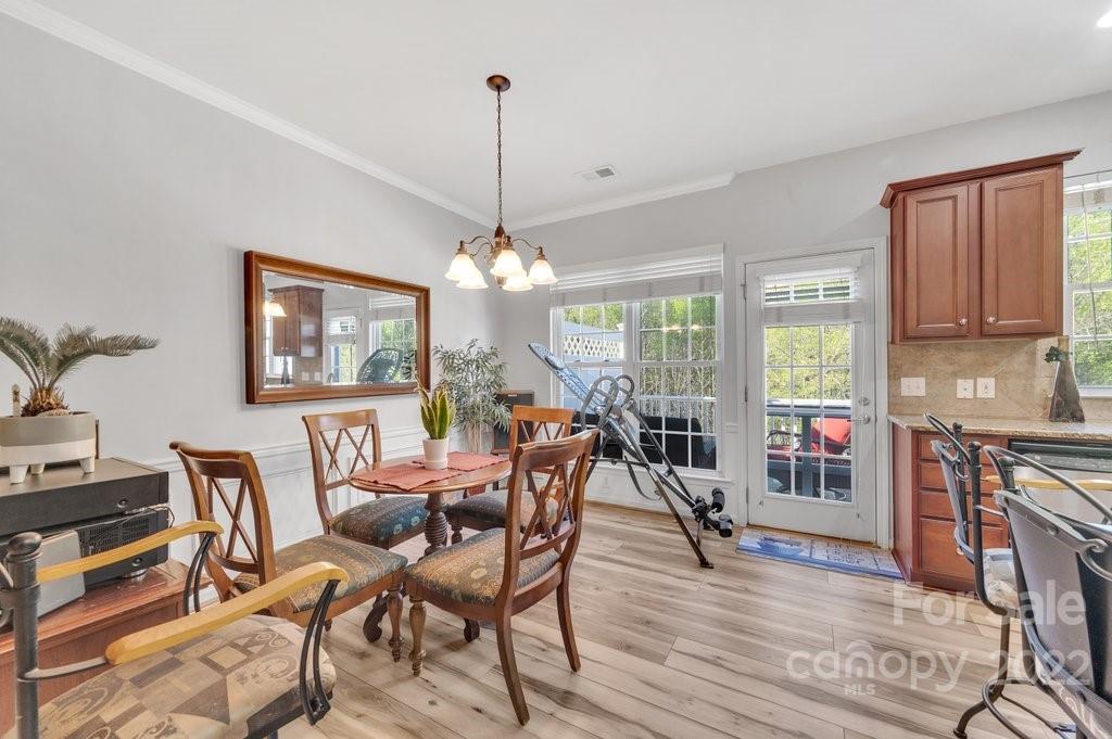584 6th Baxter Crossing Fort Mill, SC 29708 - Photo 7 of 21 a view of a dining room with furniture window and outside view