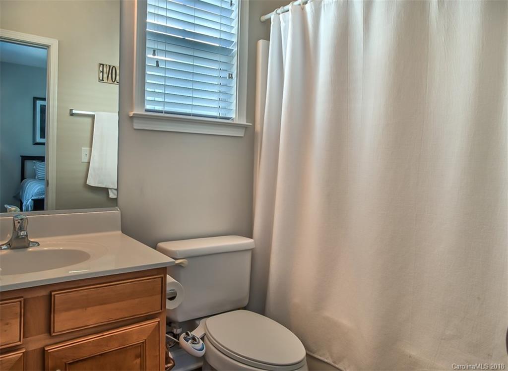 4136 Walker Road Charlotte, NC 28211 - Photo 11 of 15 a white toilet sitting next to a bathroom sink