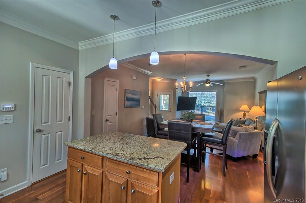 4136 Walker Road Charlotte, NC 28211 - Photo 3 of 15 a kitchen view with a table and chairs in it