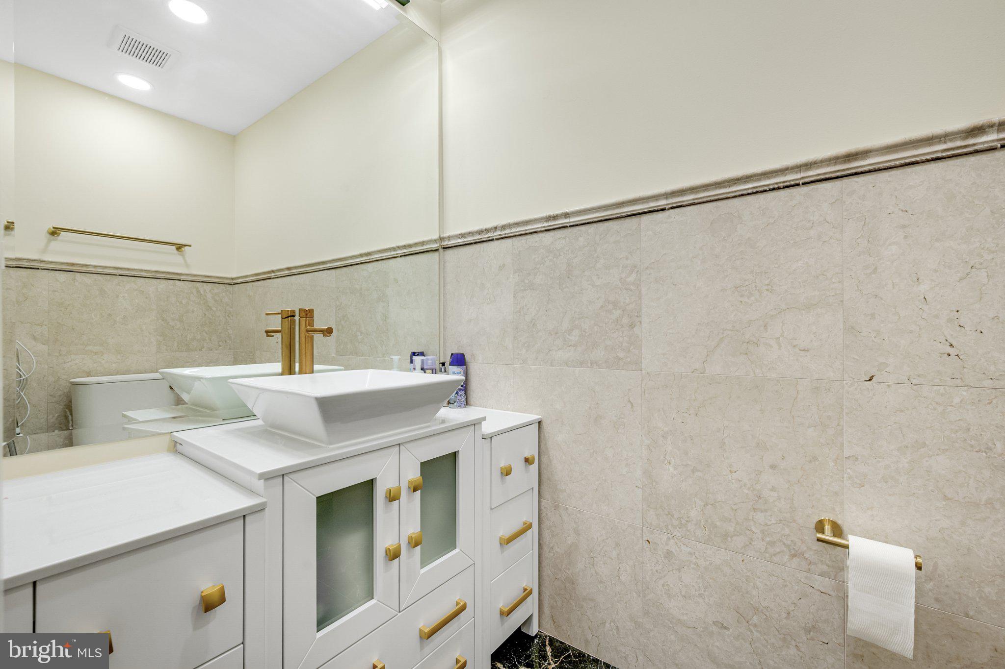 10904 Gainsborough Road Potomac, MD 20854 - Photo 26 of 32 Sleek elegance in a modern bathroom.