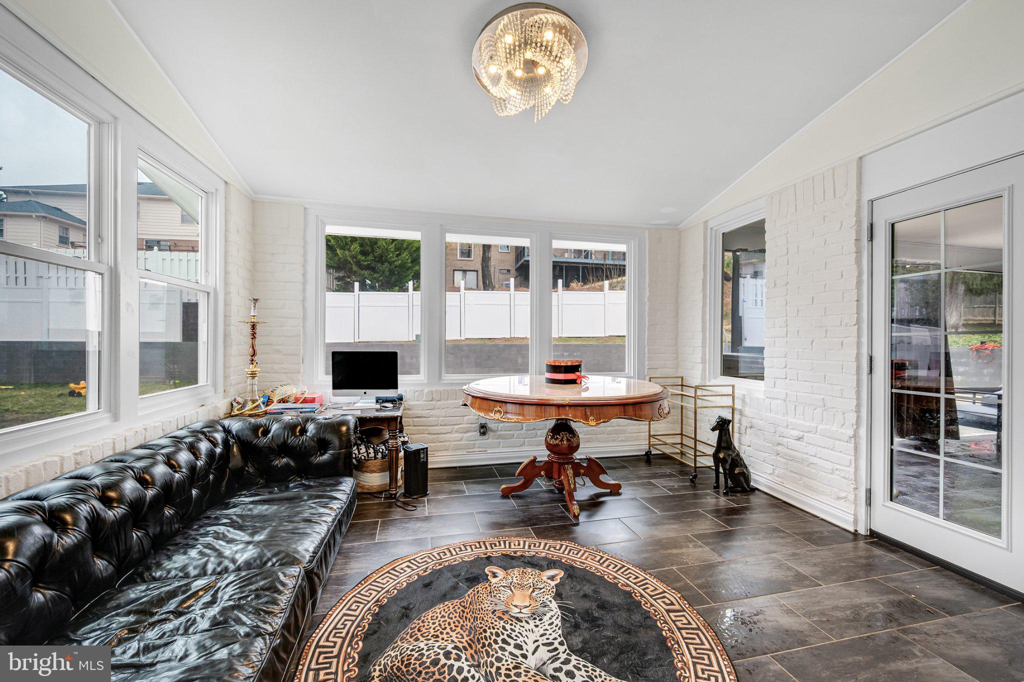 10904 Gainsborough Road Potomac, MD 20854 - Photo 27 of 32 Bright sunroom with stylish decor.