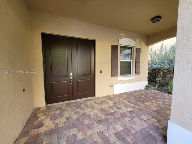 a view of a big room with a windows and closet