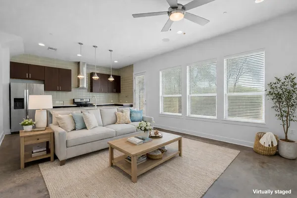a living room with furniture and a large window