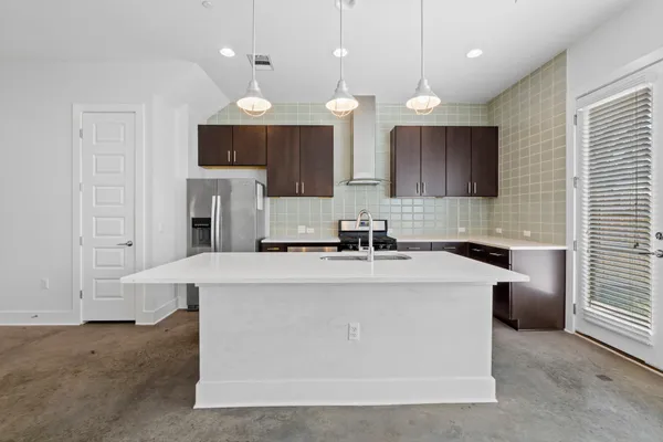 a large kitchen with cabinets