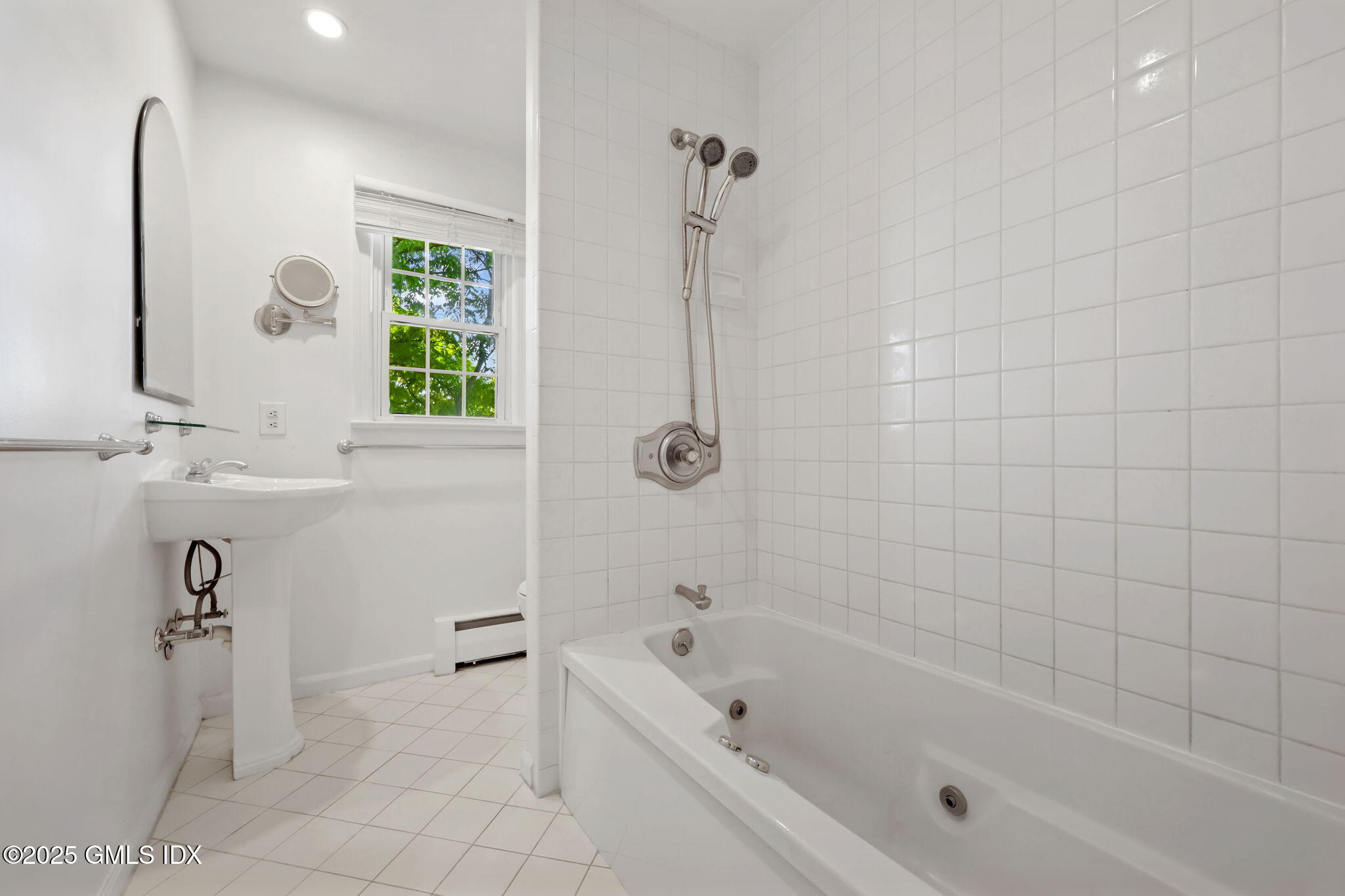 47 Valley Road, Unit B3 Cos Cob, CT 06807 - Photo 12 of 18 a bathroom with a bathtub a window and a shower