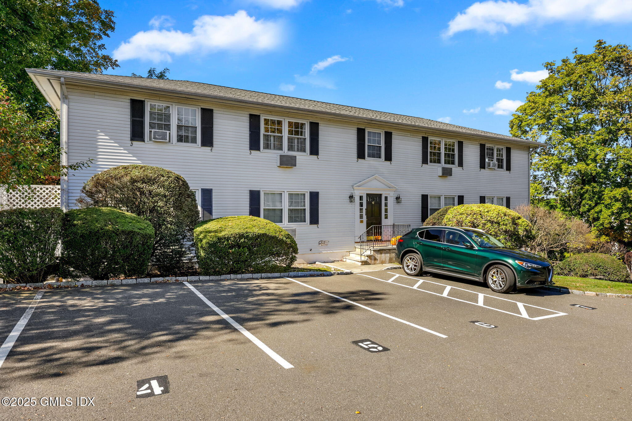 47 Valley Road, Unit B3 Cos Cob, CT 06807 - Photo 17 of 18 a car parked in front of a house