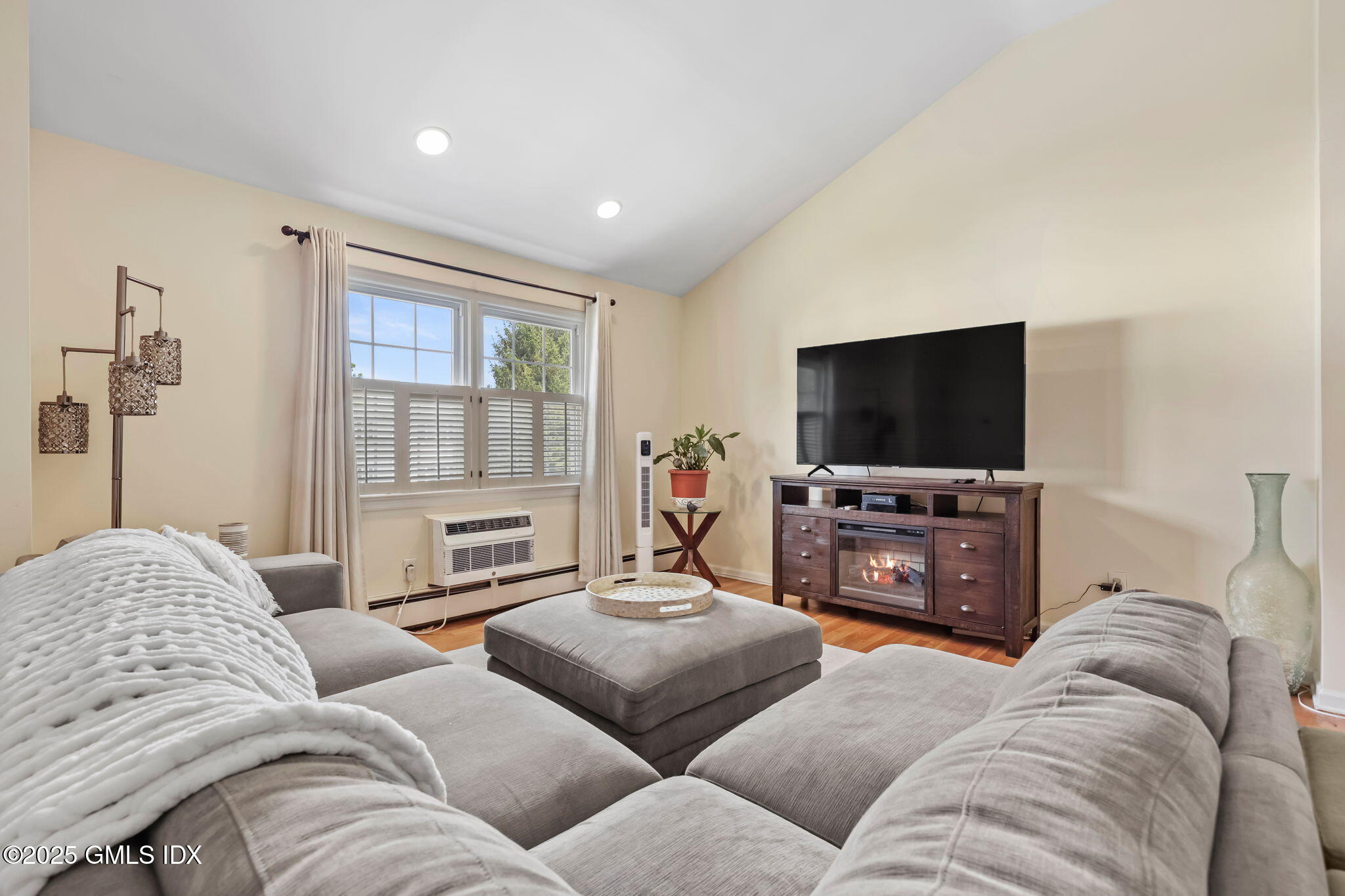 47 Valley Road, Unit B3 Cos Cob, CT 06807 - Photo 5 of 18 a living room with furniture and a flat screen tv