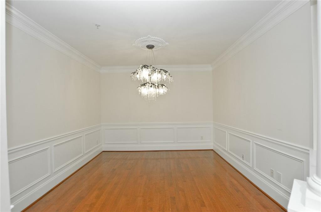 4100 Paces Walk Southeast, Unit 1305 Atlanta, GA 30339 - Photo 14 of 45 a view of a room with an empty space and a window