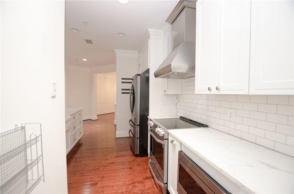 4100 Paces Walk Southeast, Unit 1305 Atlanta, GA 30339 - Photo 22 of 45 a storage room with a washer and dryer