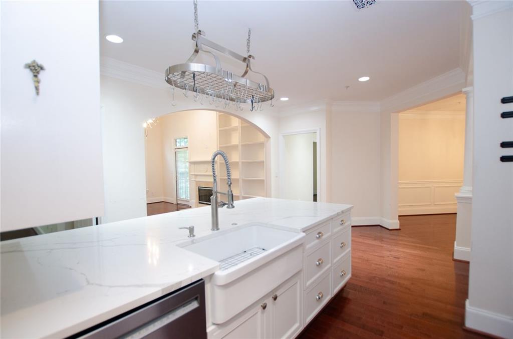 4100 Paces Walk Southeast, Unit 1305 Atlanta, GA 30339 - Photo 23 of 45 a spacious bathroom with a granite countertop sink a large mirror and vanity