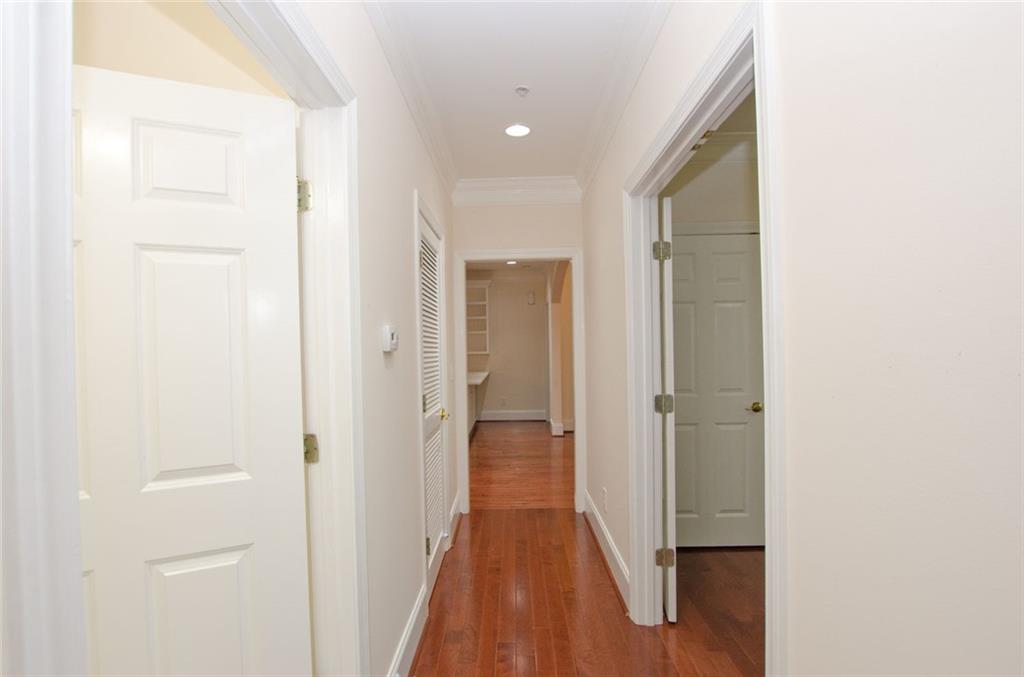 4100 Paces Walk Southeast, Unit 1305 Atlanta, GA 30339 - Photo 32 of 45 a view of a hallway with wooden floor