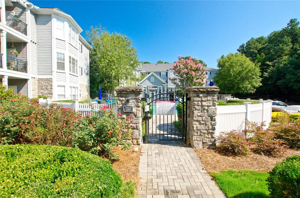4100 Paces Walk Southeast, Unit 1305 Atlanta, GA 30339 - Photo 5 of 45 a view of a building with a garden