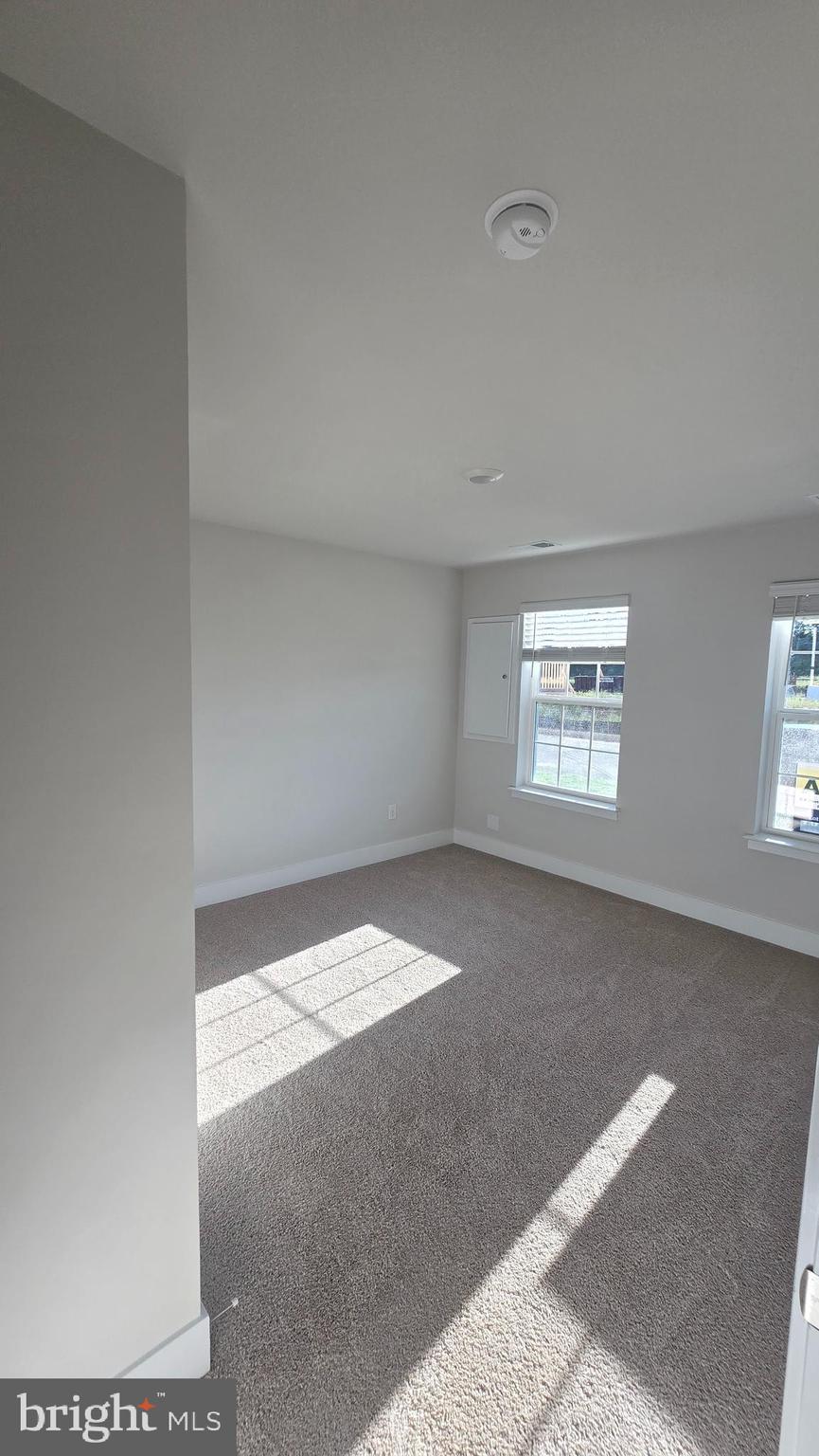 52 Aloma Street Ranson, WV 25438 - Photo 8 of 44 a view of an empty room and a window