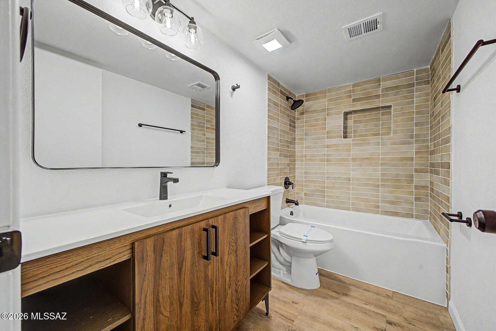3402 South Kolb Road Tucson, AZ 85730 - Photo 22 of 32 a bathroom with a sink a toilet and shower