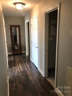 2270 Miller Road Salisbury, NC 28147 - Photo 11 of 33 a view of a hallway with wooden floor and a bathroom