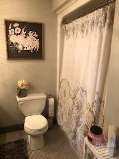 2270 Miller Road Salisbury, NC 28147 - Photo 14 of 33 a white toilet sitting next to a shower curtain