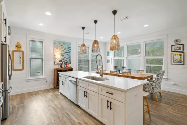 a dining room with furniture window and wooden floor