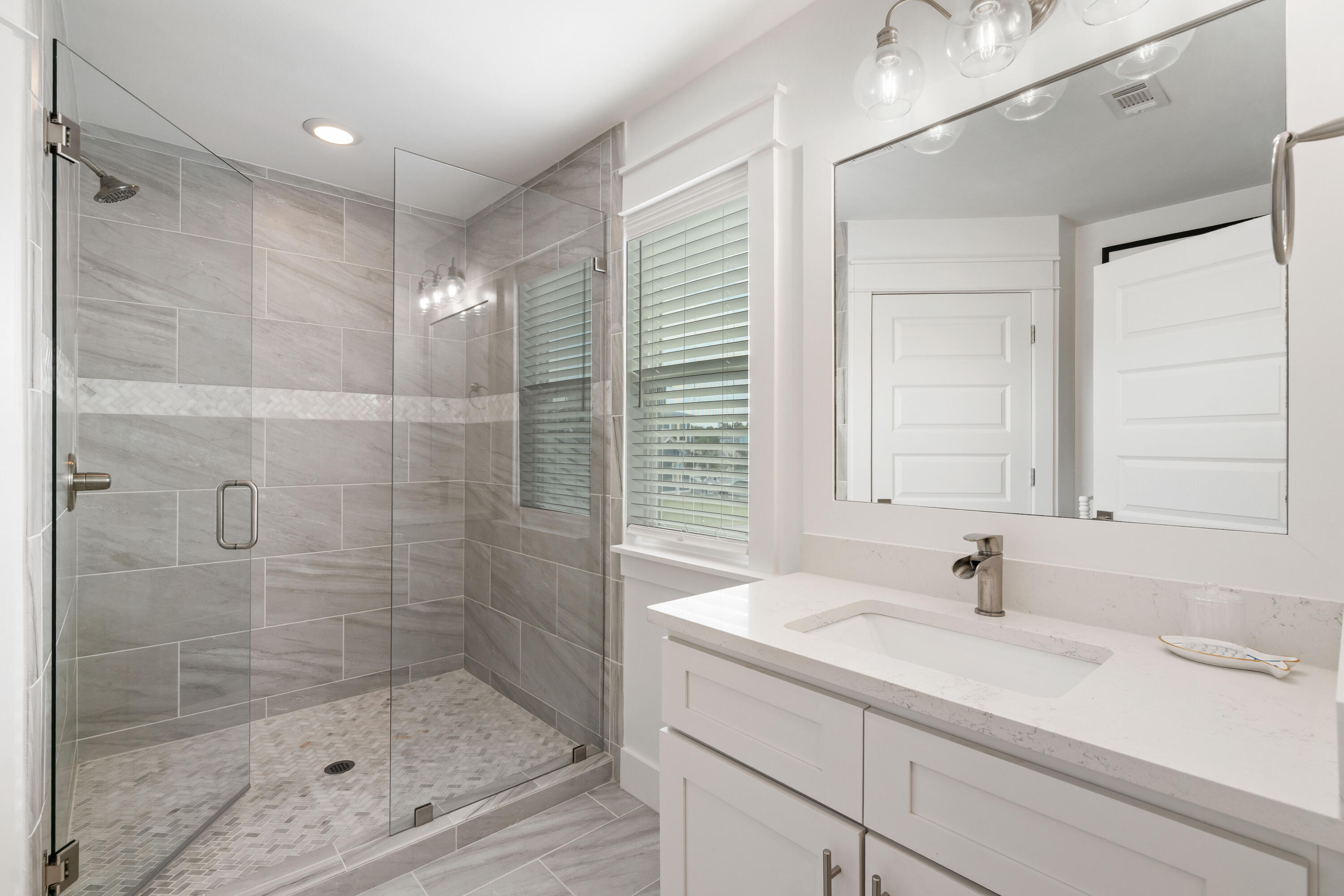 21 Seabreeze Blvd Inlet Beach Inlet Beach, FL 32461 - Photo 33 of 54 a bathroom with a shower sink and mirror