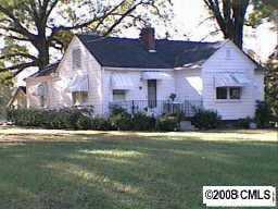 6307 Tuckaseegee Road Charlotte, NC 28208 - Photo 1 of 1 a view of a house with a yard