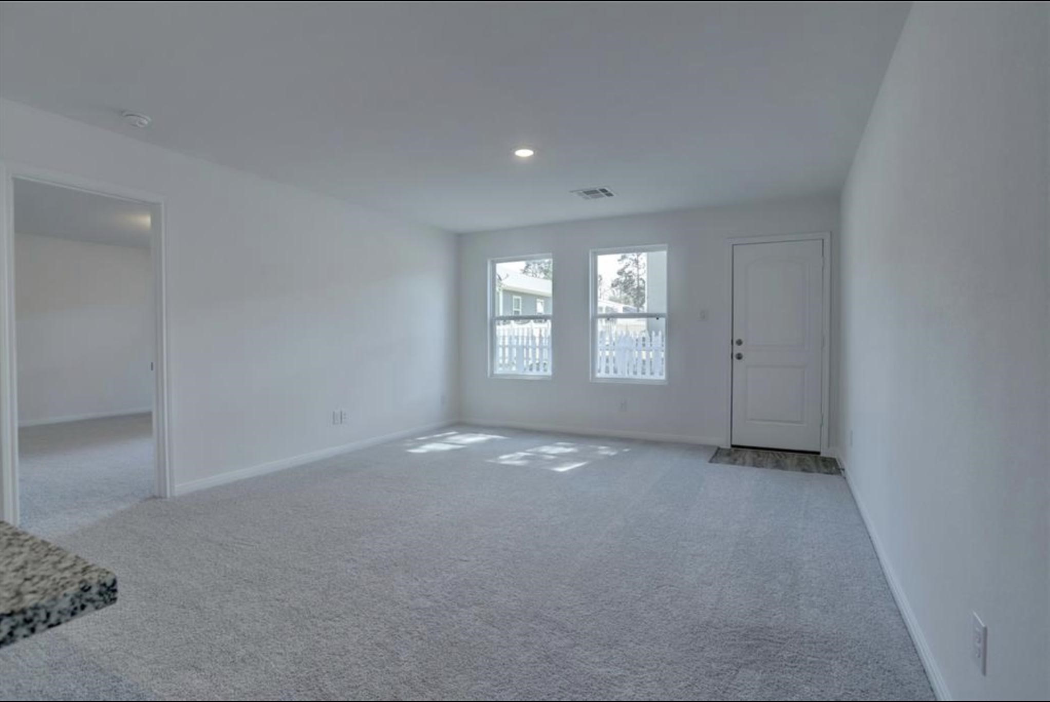 351 Red Clover Livingston, TX 77351 - Photo 12 of 33 an empty room with windows and closet