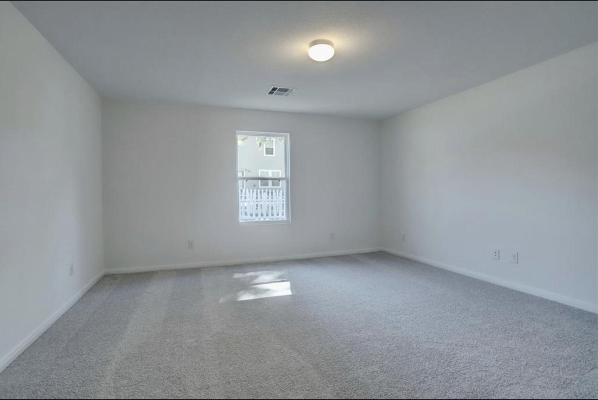 351 Red Clover Livingston, TX 77351 - Photo 13 of 33 an empty room with a window
