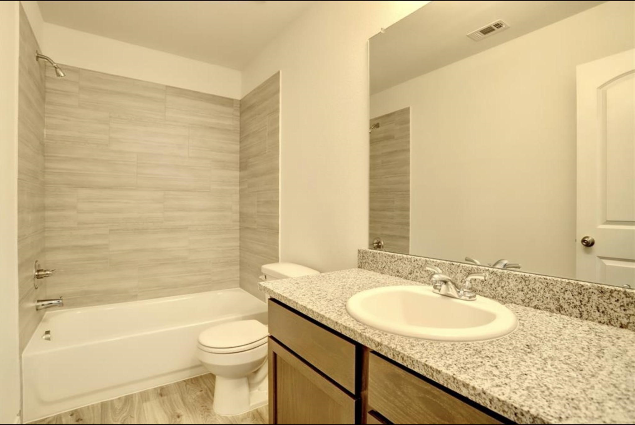 351 Red Clover Livingston, TX 77351 - Photo 15 of 33 a bathroom with a granite countertop sink toilet and shower
