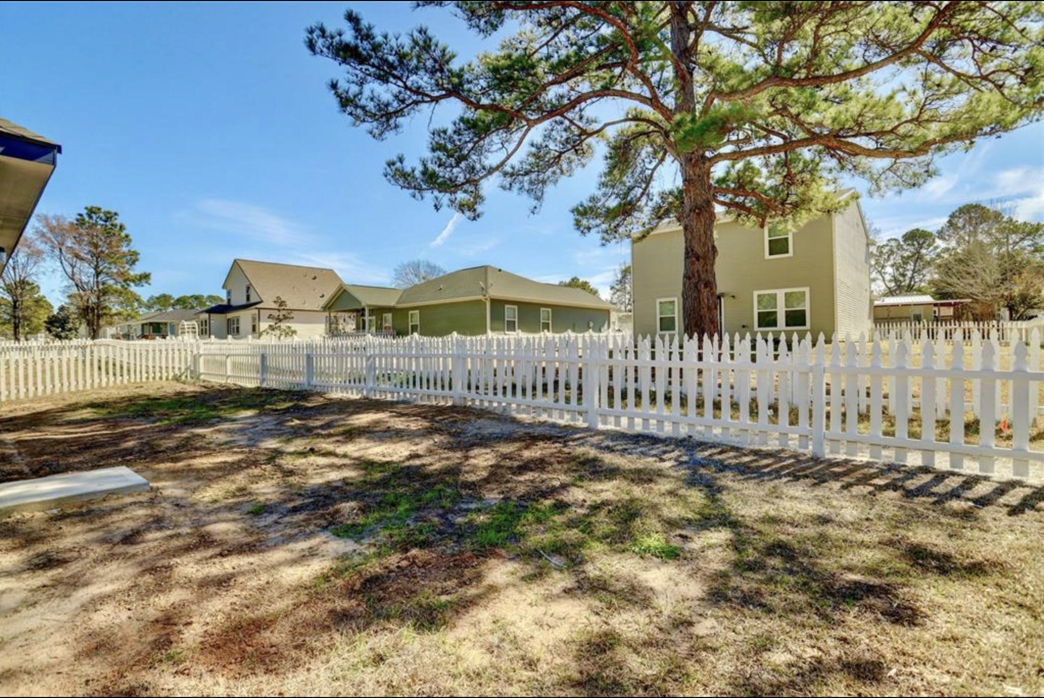 351 Red Clover Livingston, TX 77351 - Photo 26 of 33 a view of a house with a small yard and wooden fence