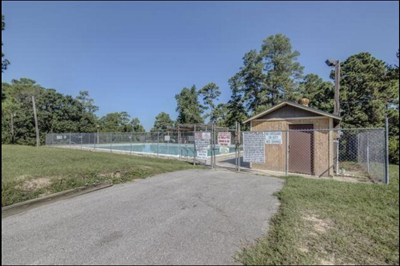 351 Red Clover Livingston, TX 77351 - Photo 27 of 33 a view of a house with backyard and trees