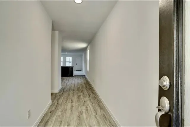 a view of a bedroom from a hallway