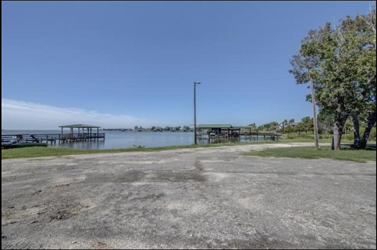 351 Red Clover Livingston, TX 77351 - Photo 32 of 33 a view of a lake with a big yard