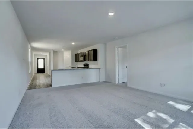 a view of a kitchen with a sink and a cabinet