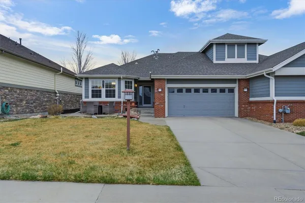 a front view of a house with yard
