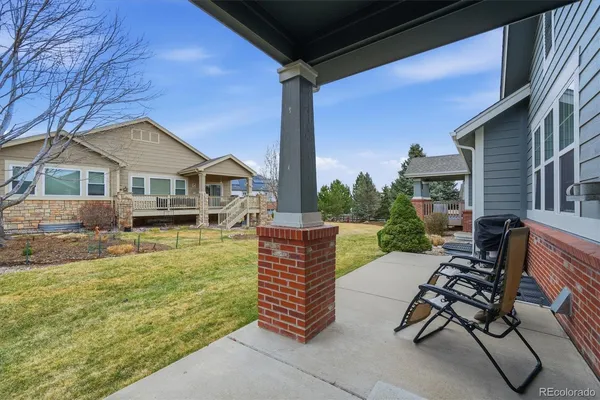 a view of a patio with couches table and chairs