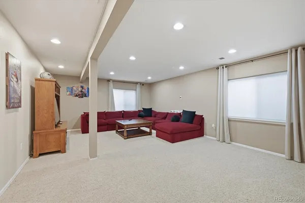a living room with furniture and a window