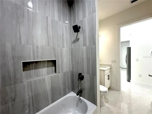 a bathroom with a sink and toilet