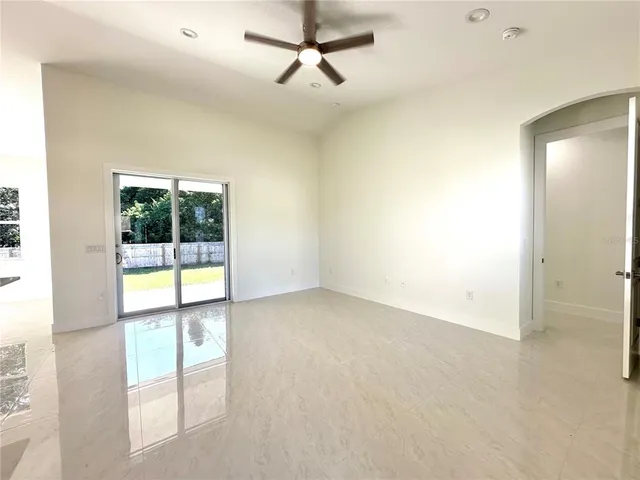 an empty room with windows and entrance