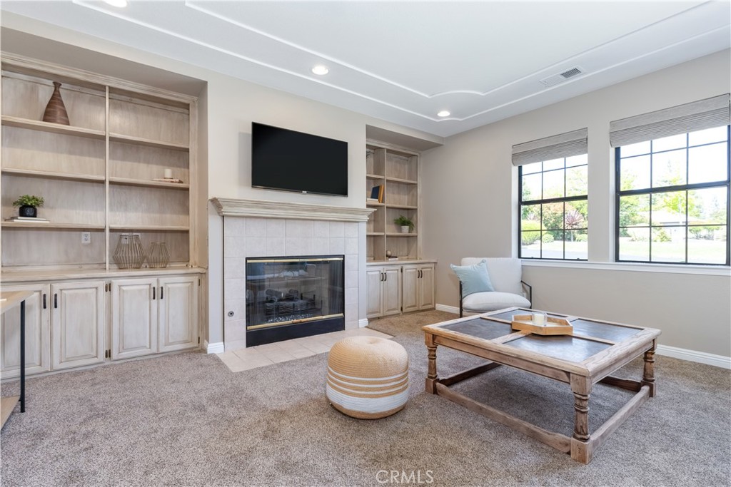 1275 Shane Lane Templeton, CA 93465 - Photo 28 of 70 a living room with furniture a flat screen tv and a fireplace