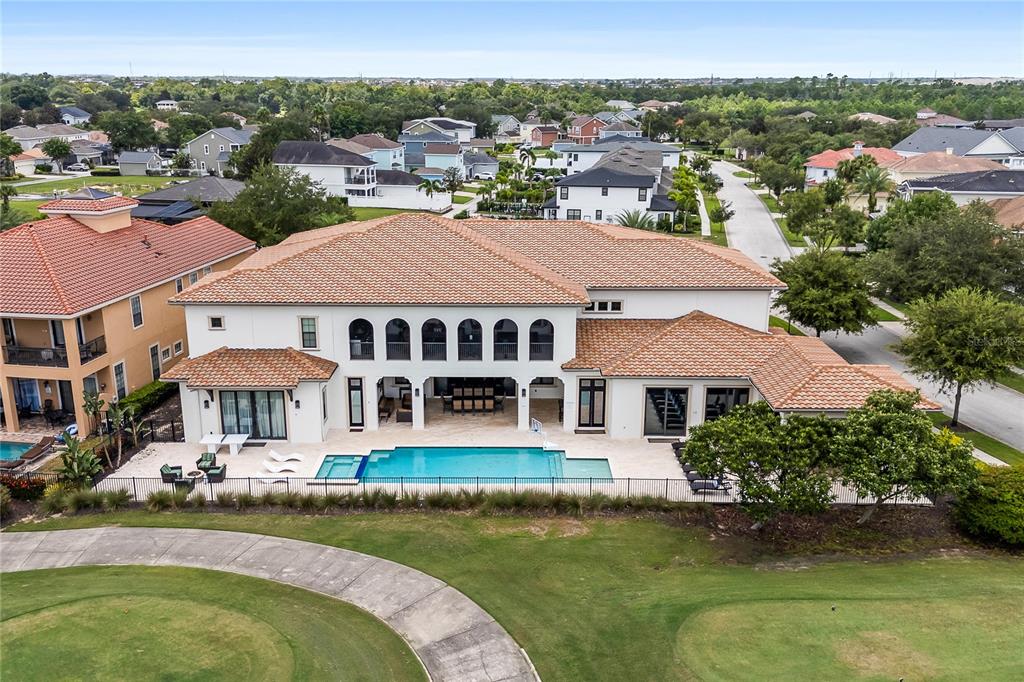 1261 Radiant Street Reunion, FL 34747 - Photo 3 of 100 an aerial view of a house with swimming pool a yard and lake view