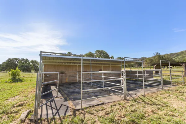 a view of a room with wooden floor and seating space