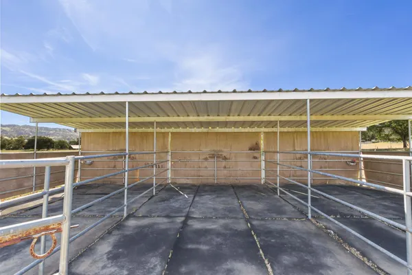 a view of an empty room with empty shelves
