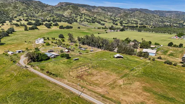 a view of a town with mountains in the background