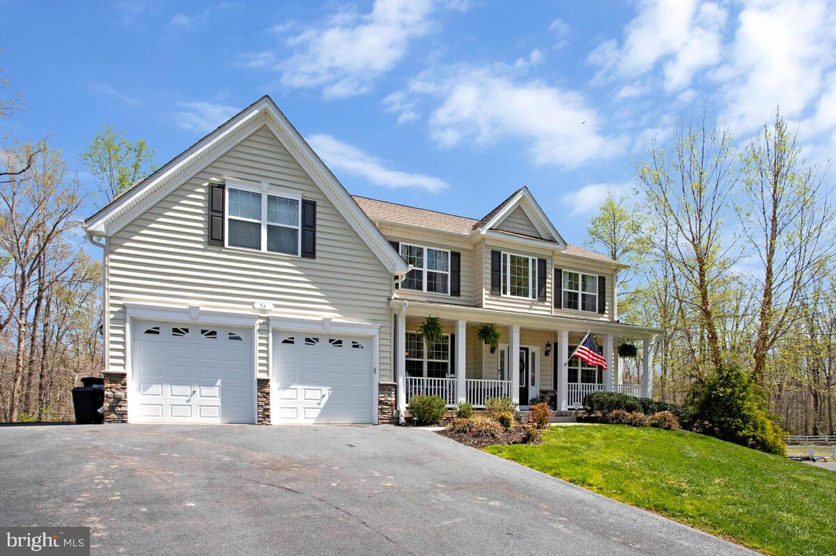 54 Simmons Ridge Road Prince Frederick, MD 20678 - Photo 2 of 55 a front view of a house with a yard