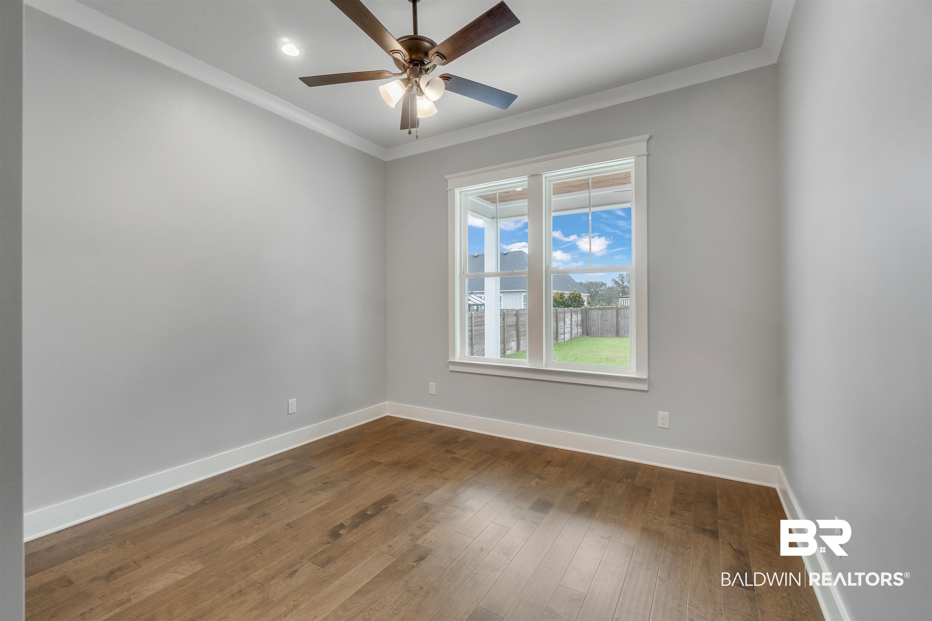 10985 Atrium Avenue Fairhope, AL 36532 - Photo 38 of 58 Spare room with crown molding, dark wood-style flooring, a ceiling fan, and recessed lighting