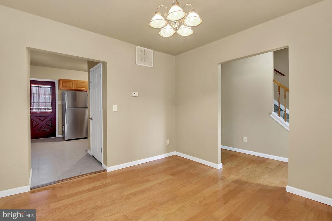 333 Back River Neck Road Baltimore, MD 21221 - Photo 4 of 25 a view of an empty room with a window