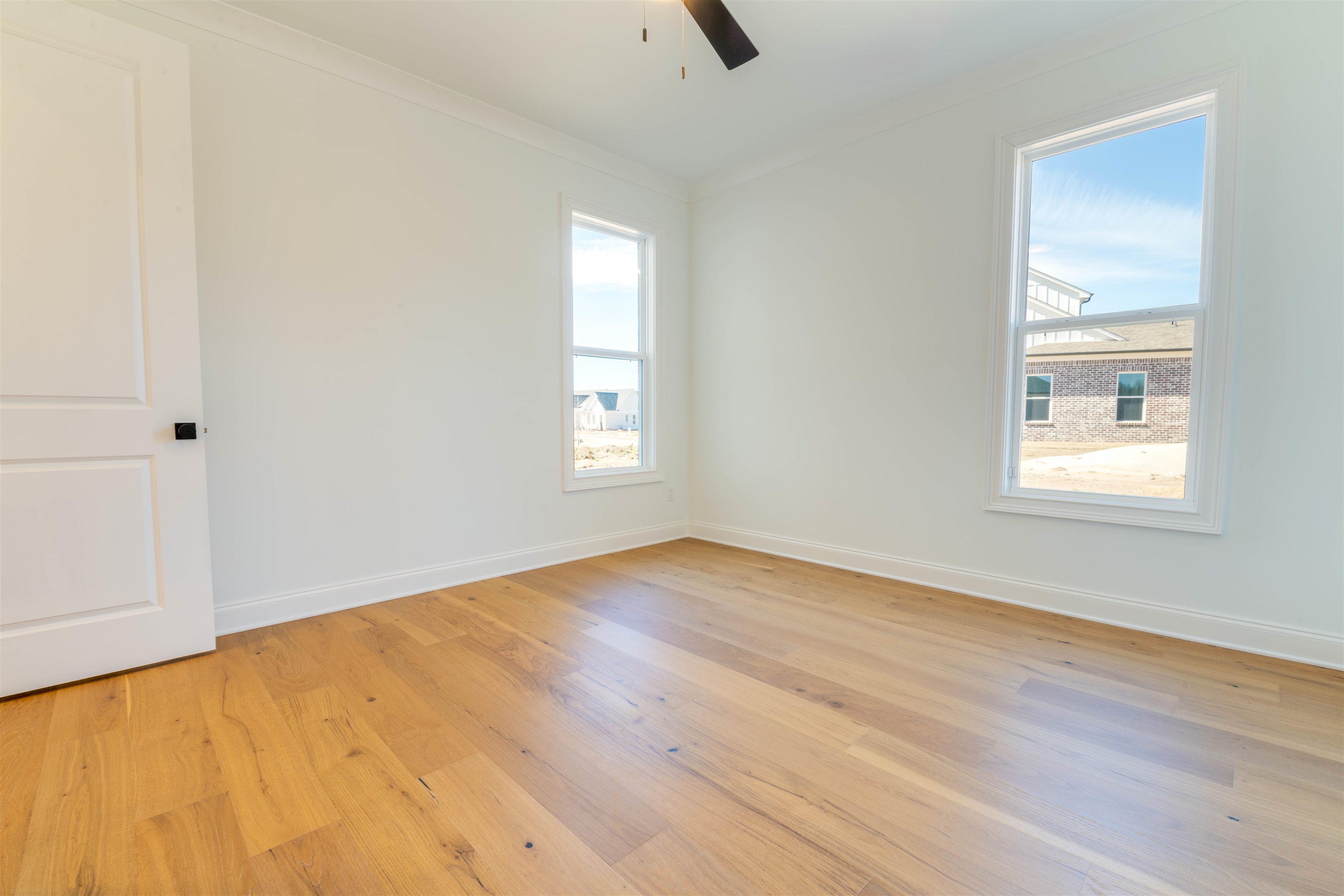30 Rambling Rex Trail Piperton, TN 38017 - Photo 13 of 25 Primary with light wood-style floors, baseboards, a wealth of natural light, and ornamental molding