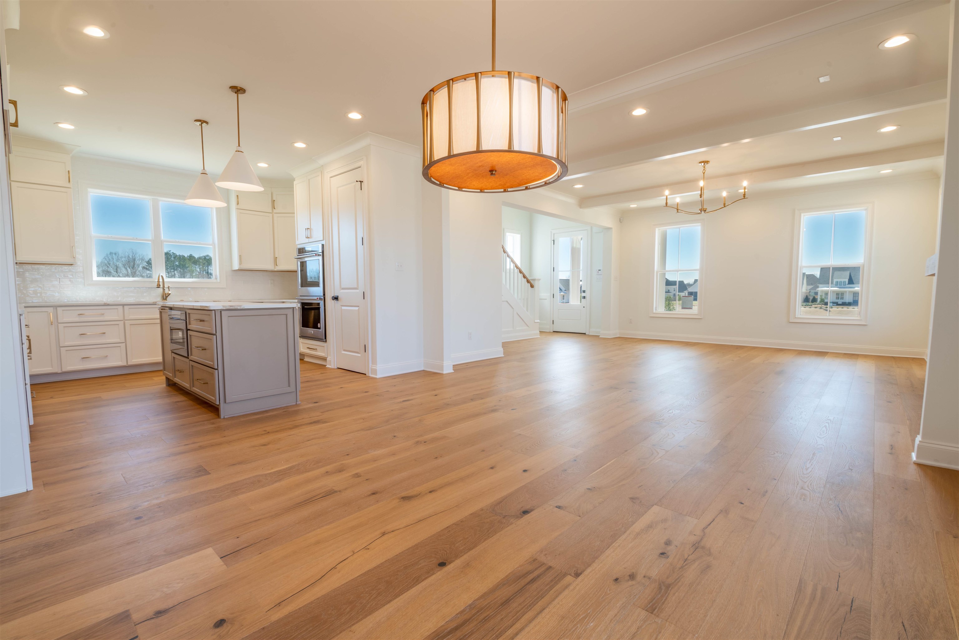 30 Rambling Rex Trail Piperton, TN 38017 - Photo 3 of 25 Interior space featuring recessed lighting, a kitchen island, light countertops, and light wood finished floors