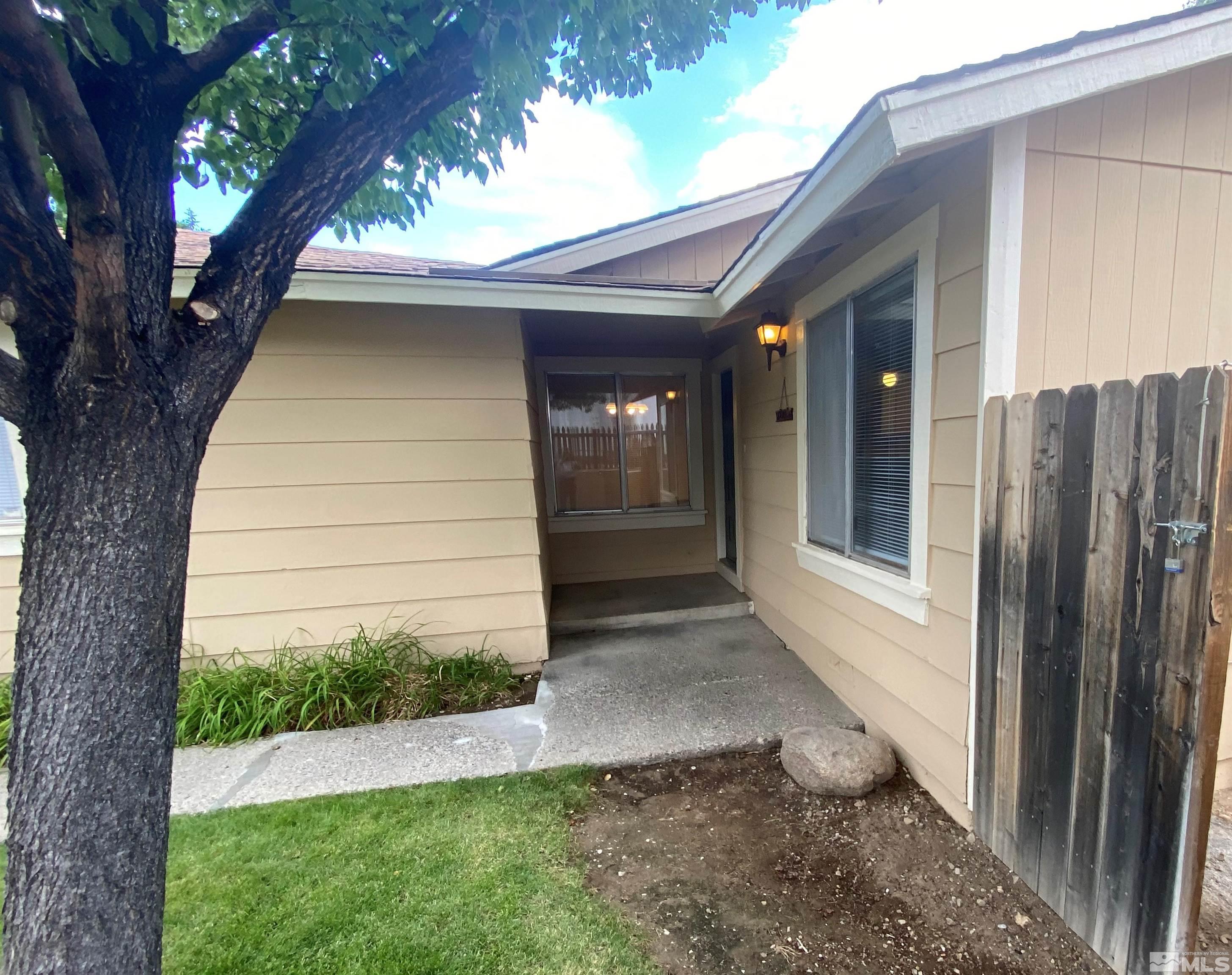 6788 Flower Street Reno, NV 89506 - Photo 3 of 23 a view of house with backyard